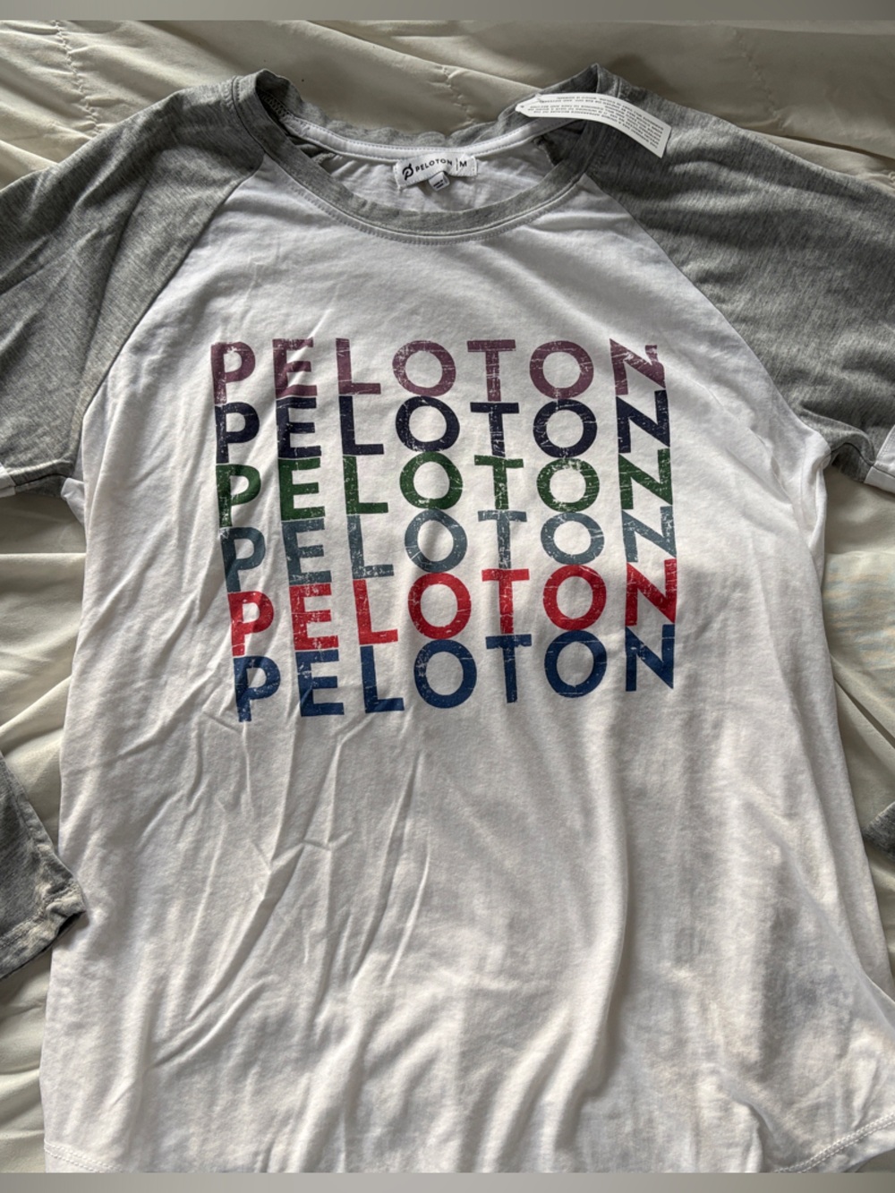 Peloton White Raglan Shirt with Gray Sleeves and Multicolor Logo